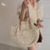 9d34a4dec9dc19c992370b9ae457845e.jpg Summer Hollow Design Round Straw Bag